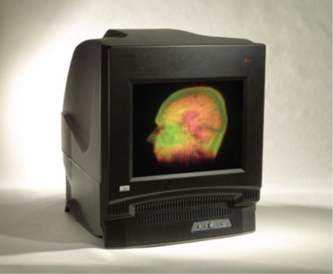 A swept-volume volumetric display showing a glowing 3D molecular structure inside a dome.