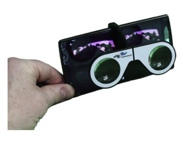 A hand holding a small folding stereoscope viewer.