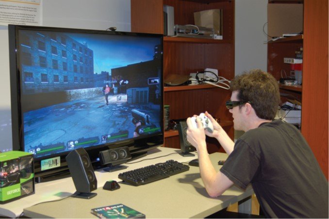 A person playing a game on a large monitor while wearing stereo glasses, an example of fishtank VR.